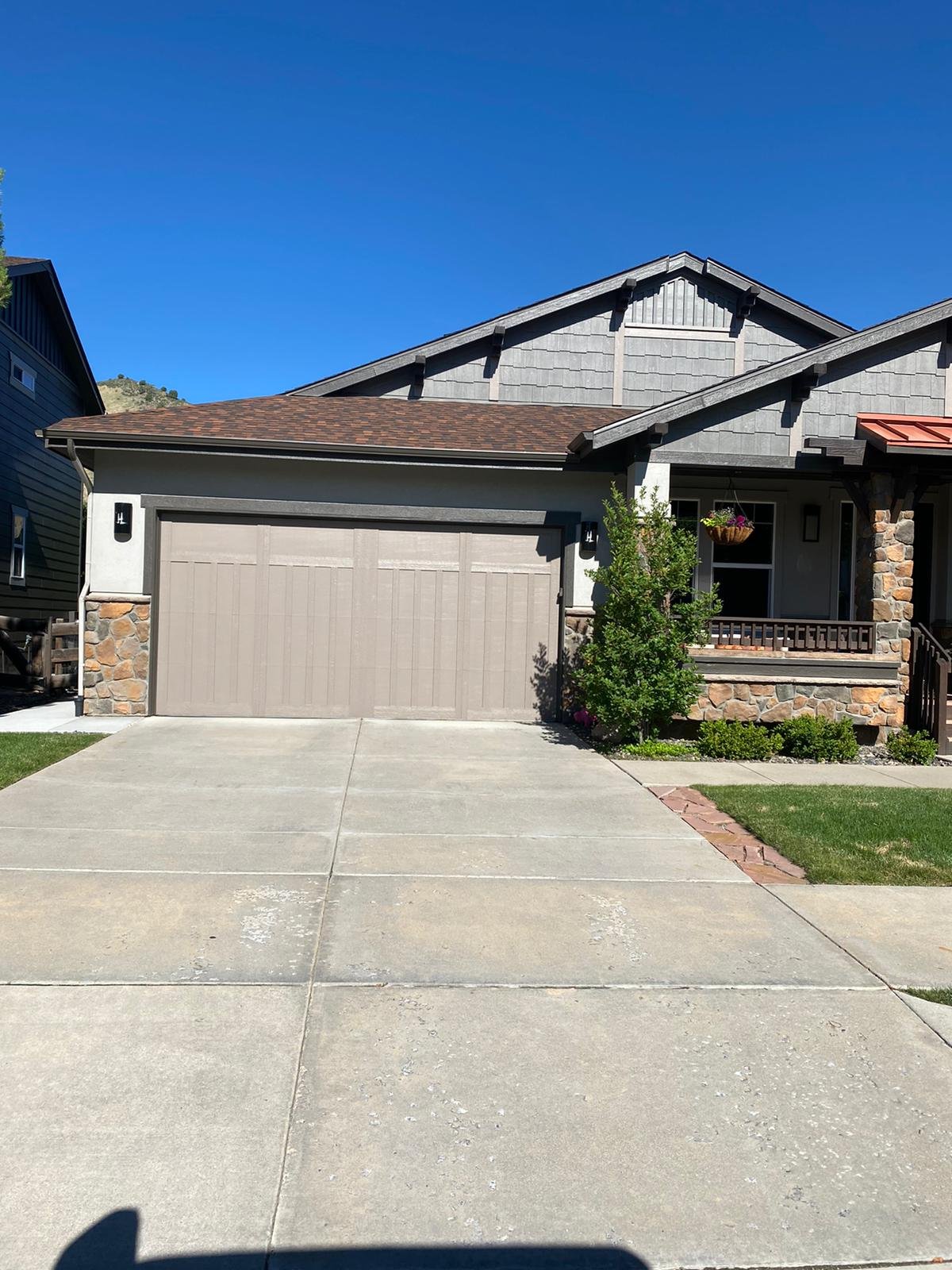 Residential garage door service | WE FIX IT Garage Door Repair Completed residential garage door exterior — garage door repair project